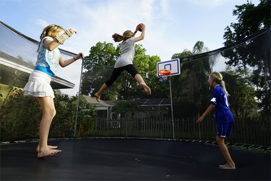 Kids playing VersaHoop on Trampoline Top Outdoor Toys like VersaHoop